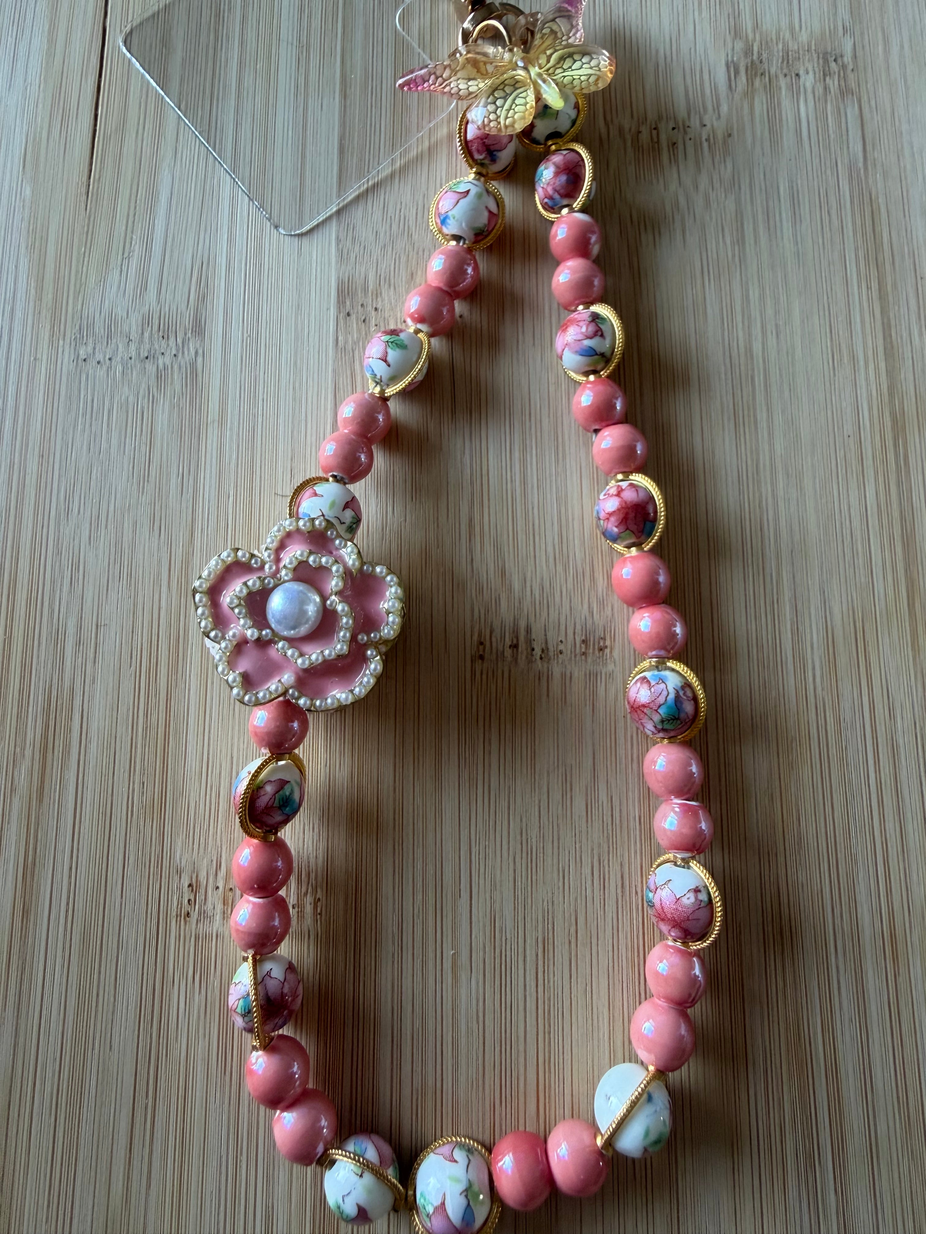 🌸 Bijou de téléphone – Perles céramiques fleuries