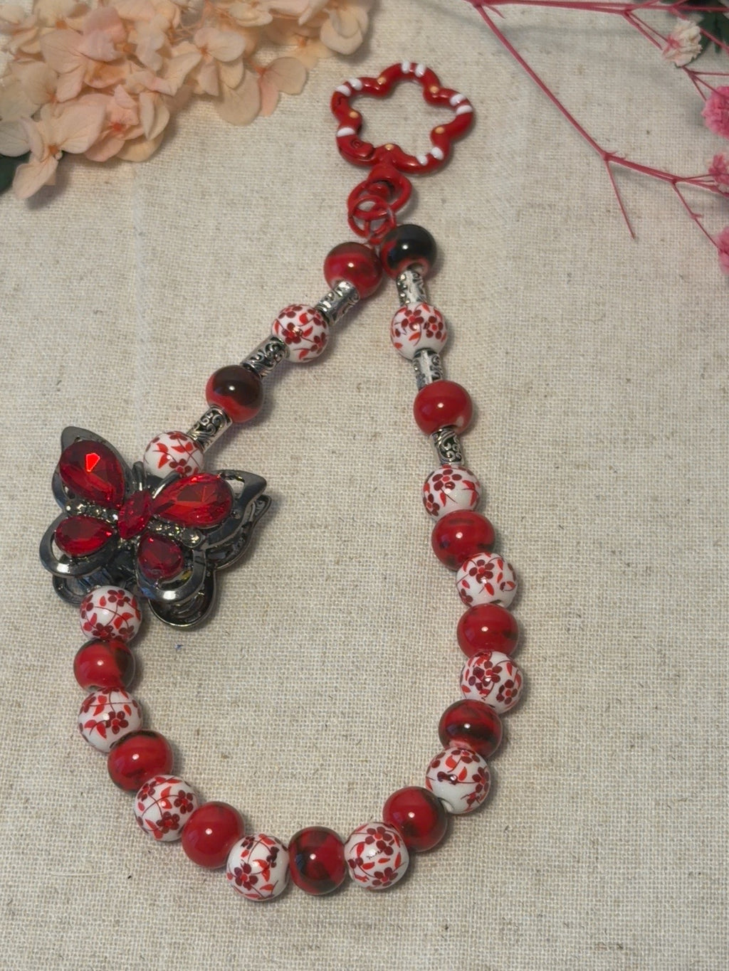 🦋 Bijou de téléphone / Bijou de sac – Papillon Rubis