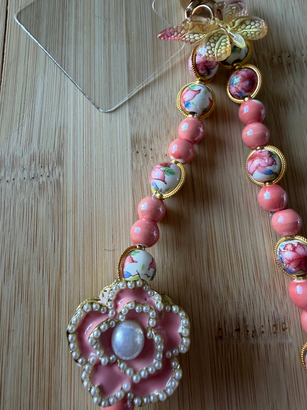 🌸 Bijou de téléphone – Perles céramiques fleuries