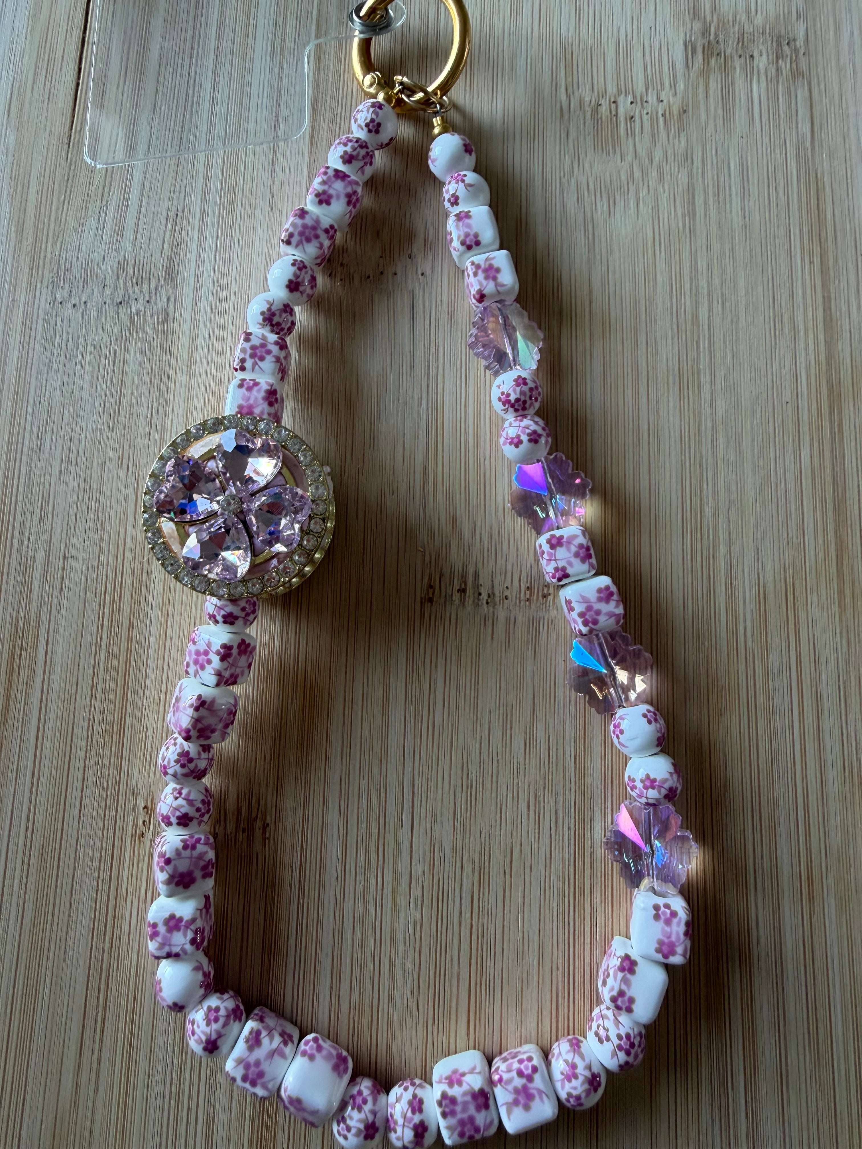 🌸 Bijou de téléphone – Perles céramiques fleuries