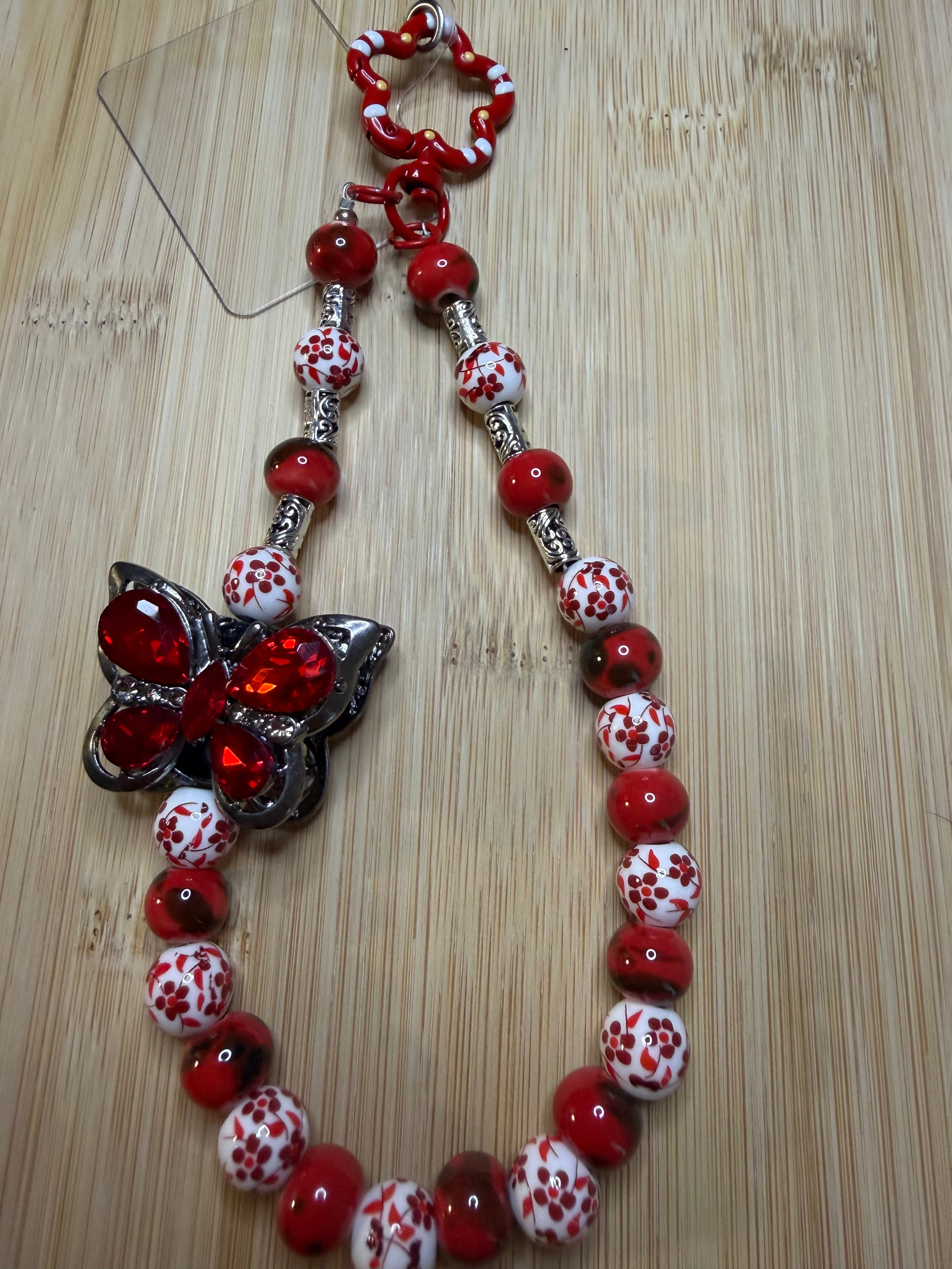 🦋 Bijou de téléphone / Bijou de sac – Papillon Rubis
